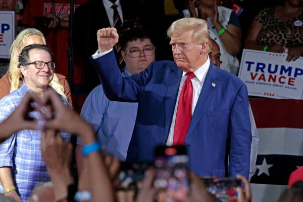 Former US President and Republican presidential candidate Donald Trump attends a town hall meeting moderated by Arkansas Governor Sarah Huckabee Sanders at the Dort Financial Center in Flint, Michigan, on September 17, 2024.