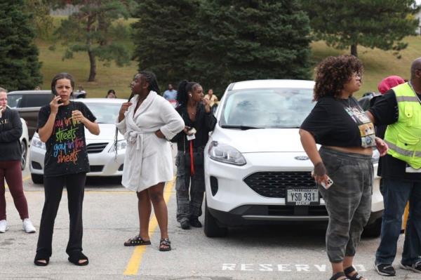 family's gather to pick up students at Omaha high school