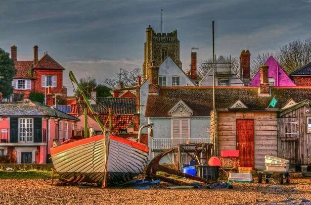 Aldeburgh is a coastal town in Suffolk, UK. The town is notable for its shingle beach and fisherman huts where freshly caught fish are sold daily.