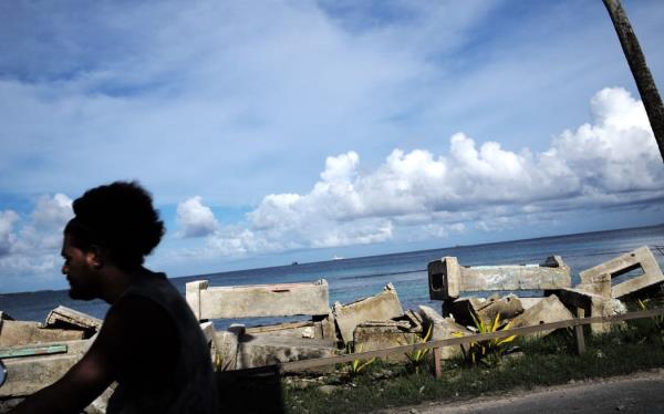 Cement blocks were stacked on the seafront at Teone to protect the houses from the swell.
Des blocs de ciment ont ete empiles sur le front de mer a Teone pour proteger les habitations de la houle. (Photo by THEO ROUBY / Hans Lucas / Hans Lucas via AFP)