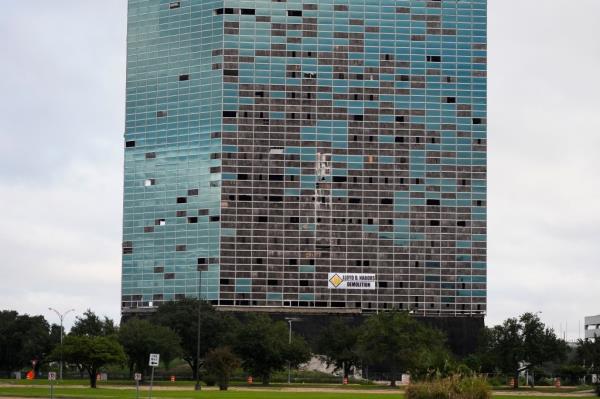 The building came crashing down on itself after a demolition crew set off explosions inside the skyscraper.