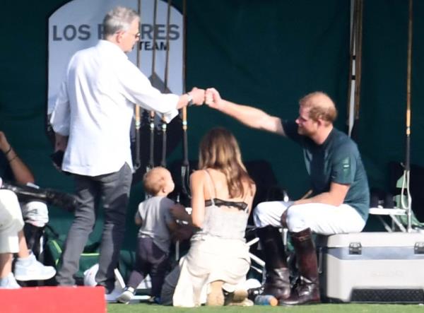 Prince Harry falling during a polo match, while David Foster, Katherine McPhee and their baby boy Rennie watch from the sidelines