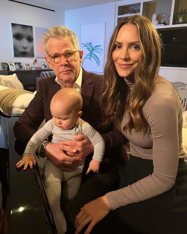 Katharine McPhee and David Foster holding a baby