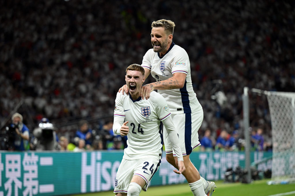 Cole Palmer of England celebrates scoring his team's first goal with teammate Luke Shaw during the UEFA EURO 2024 final match between Spain and England at Olympiastadion 