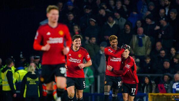 Manchester United's Marcus Rashford celebrates with team-mate Alejandro Garnacho.